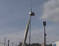 Man dangles from flagpole