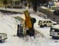 Snow plow falls in hole