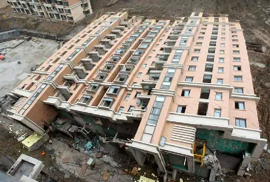 Newly built apartment building tips over in China