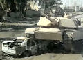 Tank rolls over car bomb